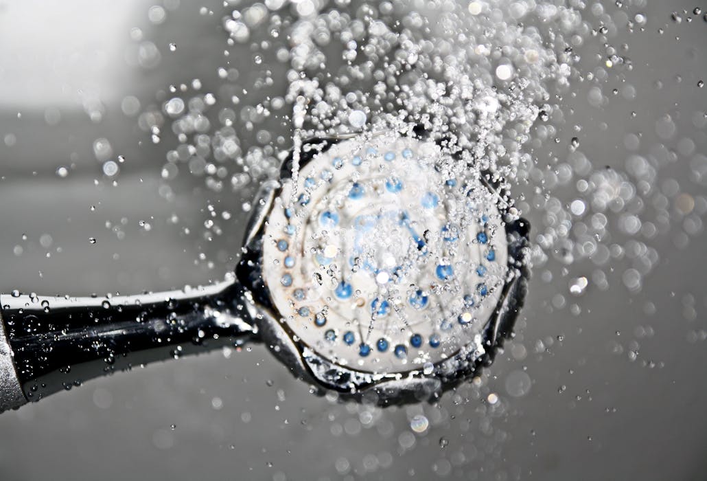 Hot water plumbing shower head