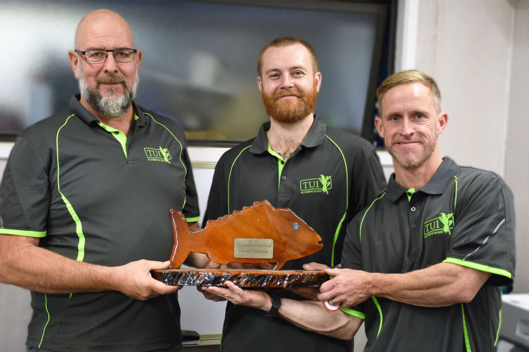 Tui Team with fishing trophy