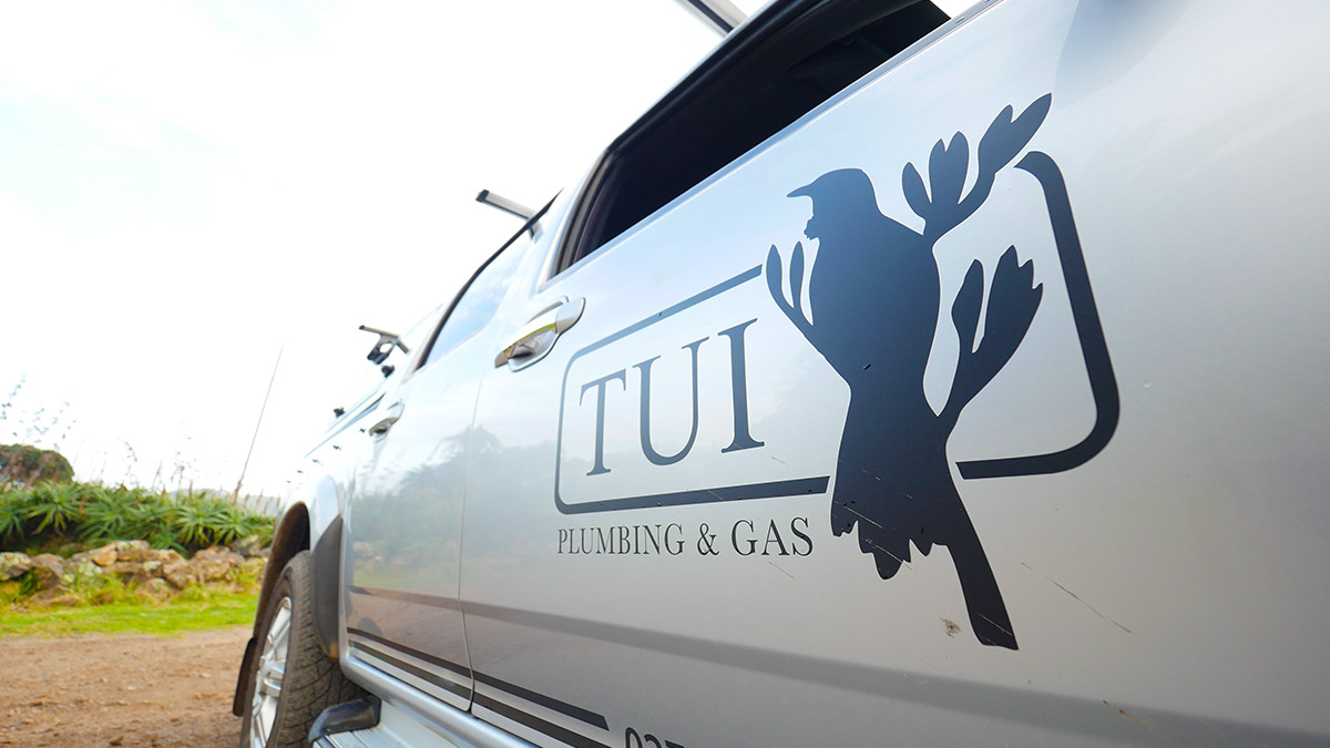 tui plumbing logo on vehicle