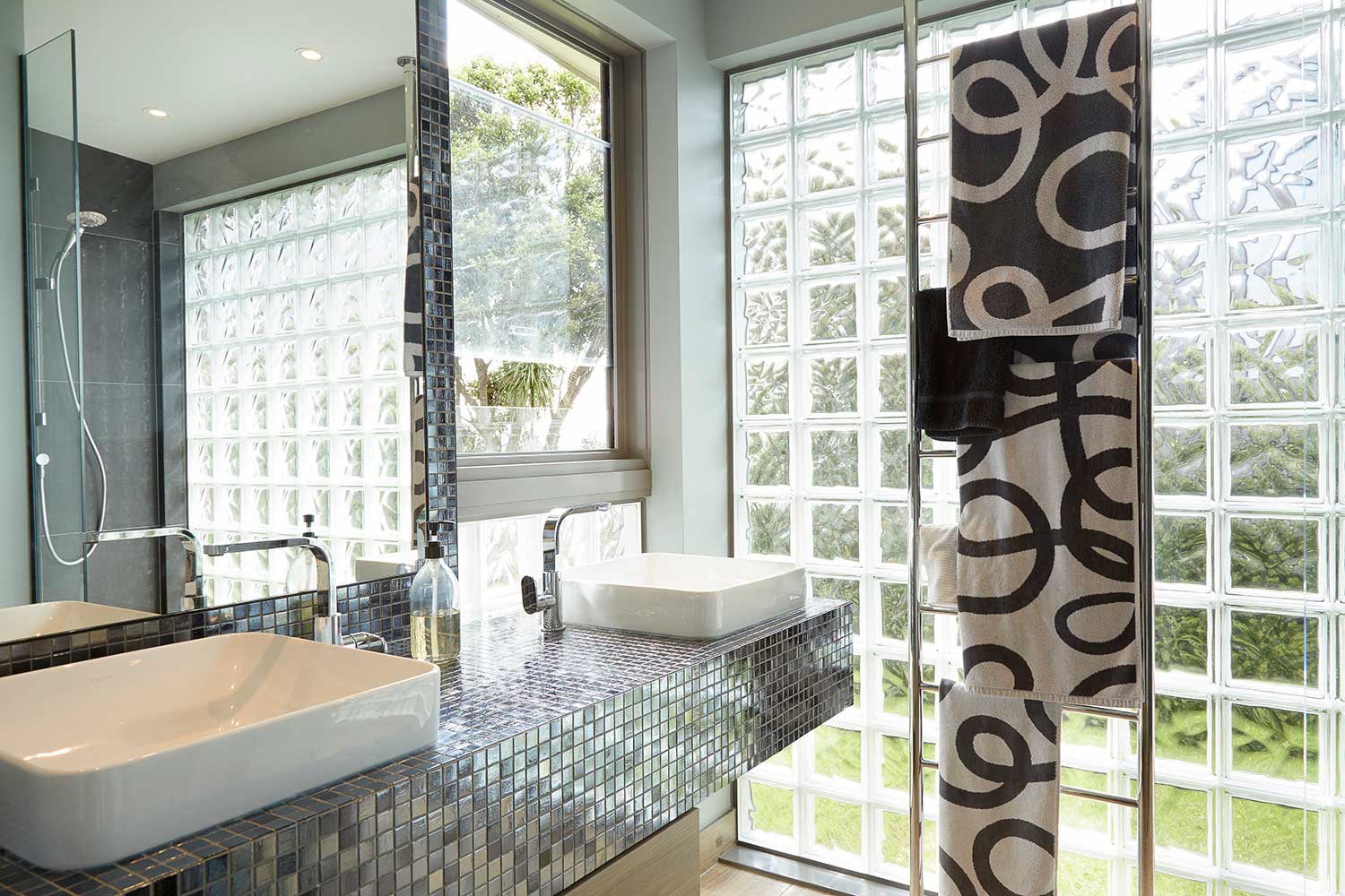 Renovated bathroom basins and glass wall