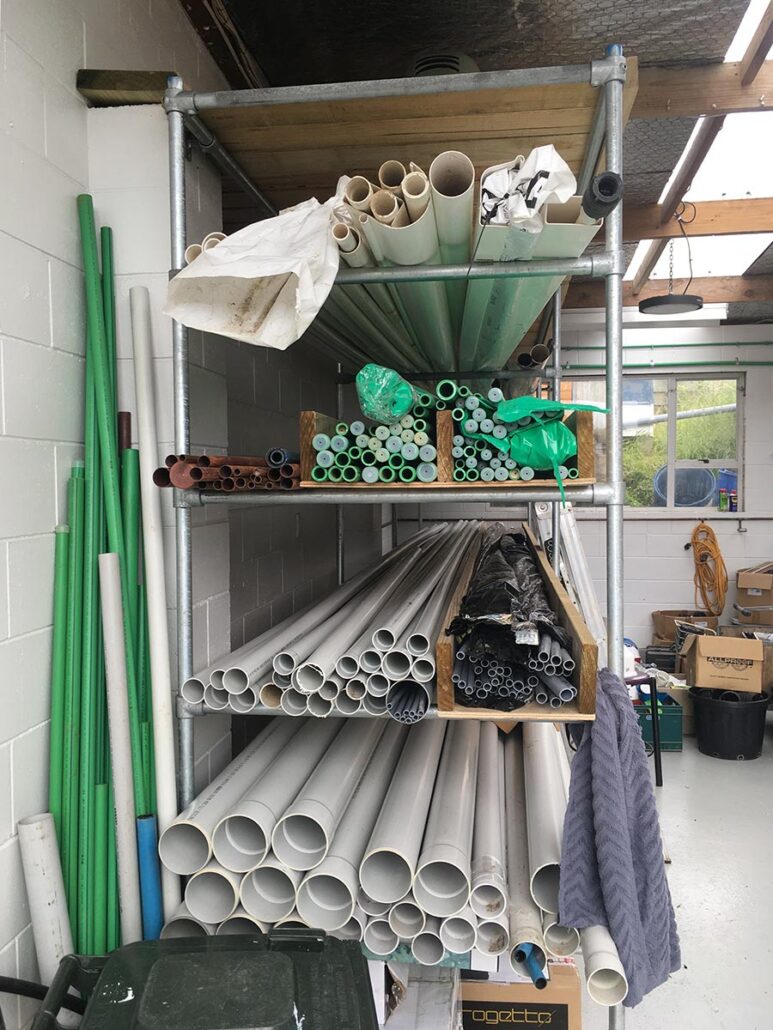 Plumbing supplies in a wall rack